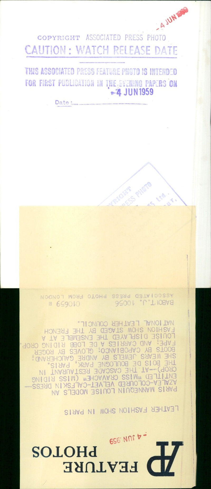 A mannequin models an azalea-coloured velvet-calfskin dress at a leather fashion show in Paris. - Vintage Photograph