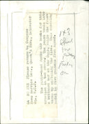 A model wearing a pixie-hooded tan suede creation from Agmar. - Vintage Photograph