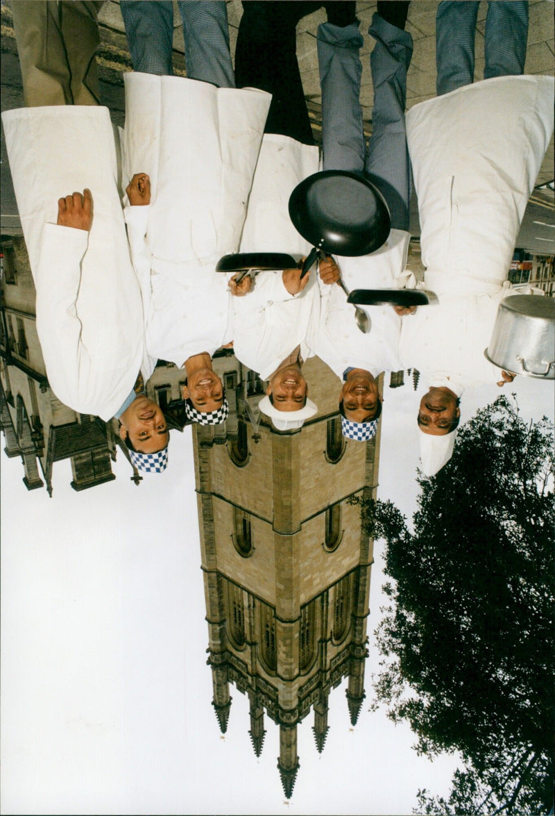 Chef Terry Lee serving up a plate of his signature dish, Curry 4+. - Vintage Photograph