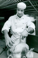 A bear stands in the middle of a wooded area. - Vintage Photograph