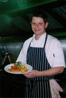 A crowd of people enjoying a concert in a park. - Vintage Photograph