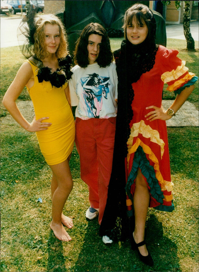 15-year-old Layla Blauder models a fashion design alongside models Clare Newbold and Amber Hards. - Vintage Photograph