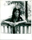 Singer-songwriter Buffy Sainte-Marie smiles during a press photo shoot. - Vintage Photograph