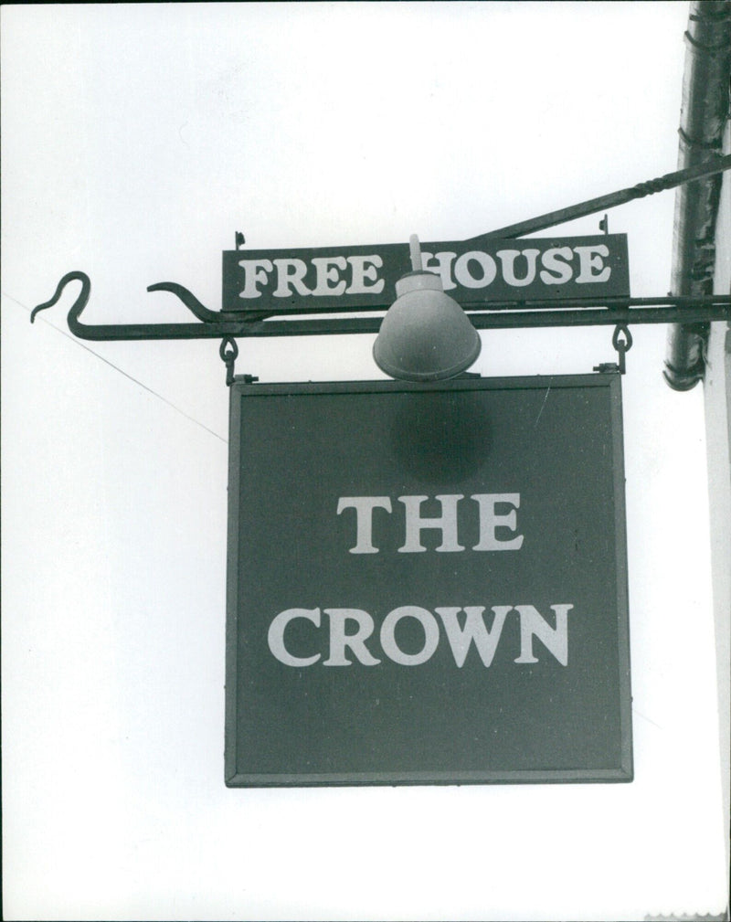 Patrons gather outside The Crown Inn, a popular pub and live music venue in Lake Street, on December 31st, 1983. - Vintage Photograph