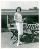 Actress Barbara Shelley models a light-cream wool Toga dress with gold Yemenite embroidery. - Vintage Photograph