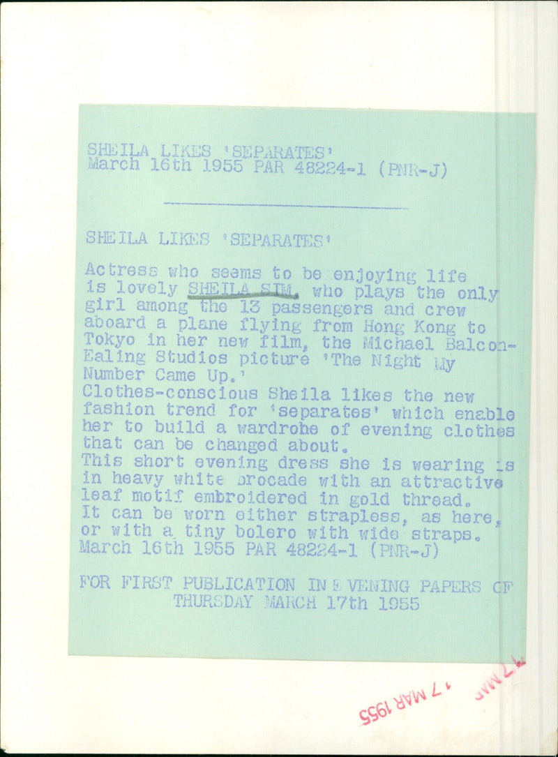 Actress Sheila Sim models a white brocade evening dress with a gold leaf motif. - Vintage Photograph