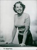 A woman models a new summer outfit in the streets of Berlin, Germany. - Vintage Photograph