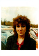 A woman stands in the crowd at Opronic Stronic, an annual music festival. - Vintage Photograph