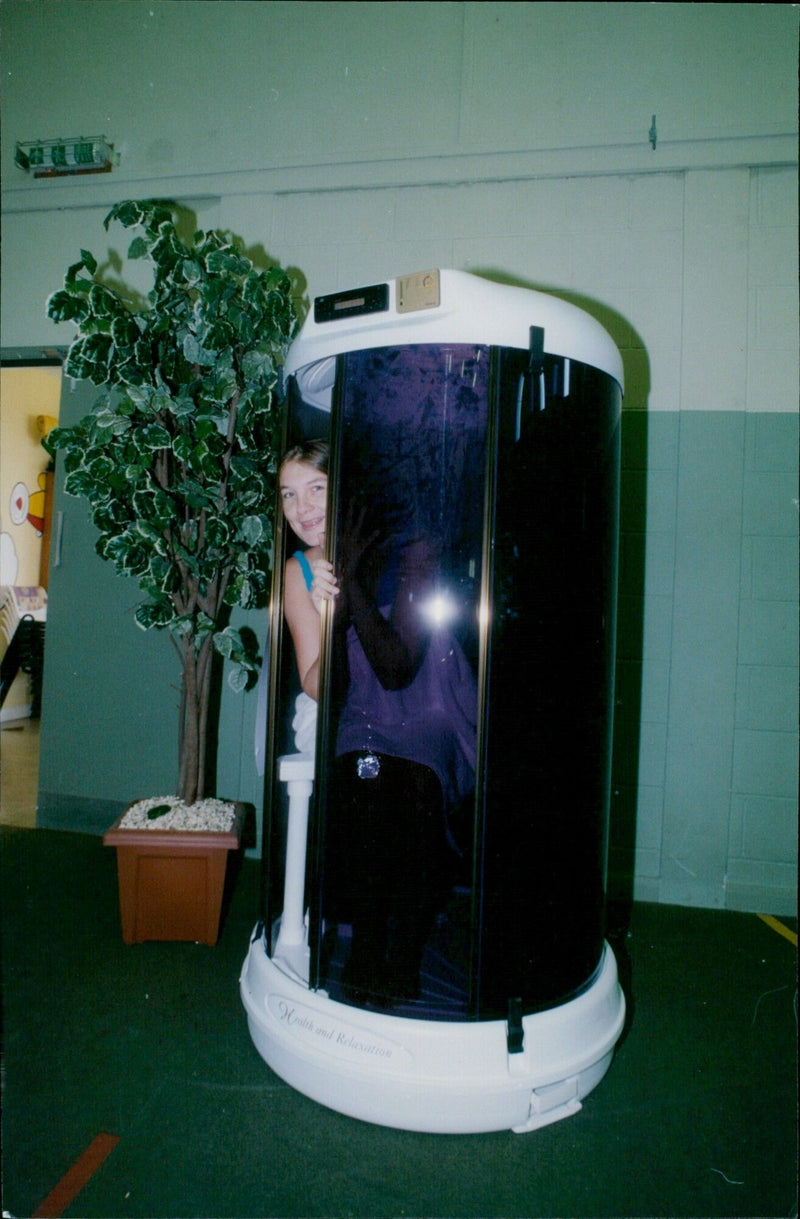 A Viators TEMAN team Capsule Kidlington user relaxes in a sensory deprivation tank. - Vintage Photograph