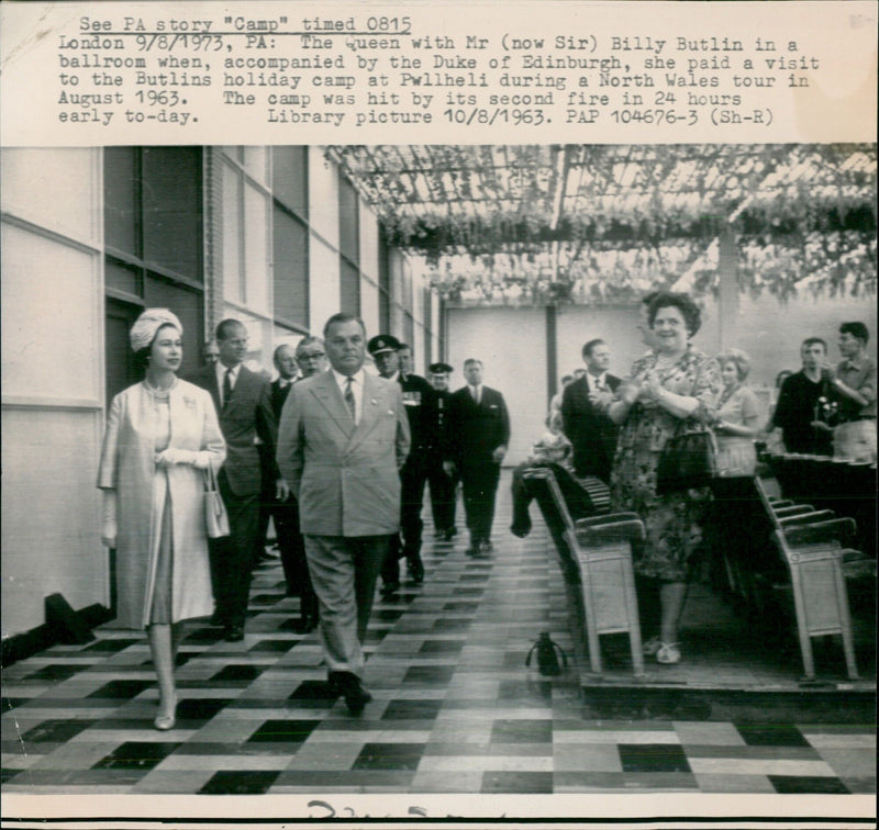 Queen Elizabeth II and Sir Billy Butlin pictured in a ballroom during a visit to the Butlins holiday camp in Pwllheli, Wales. - Vintage Photograph