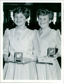 Butlins Festivals of Music & Dance winner Samantha Coe (right) and Joanne Lloyol celebrate with a hug. - Vintage Photograph