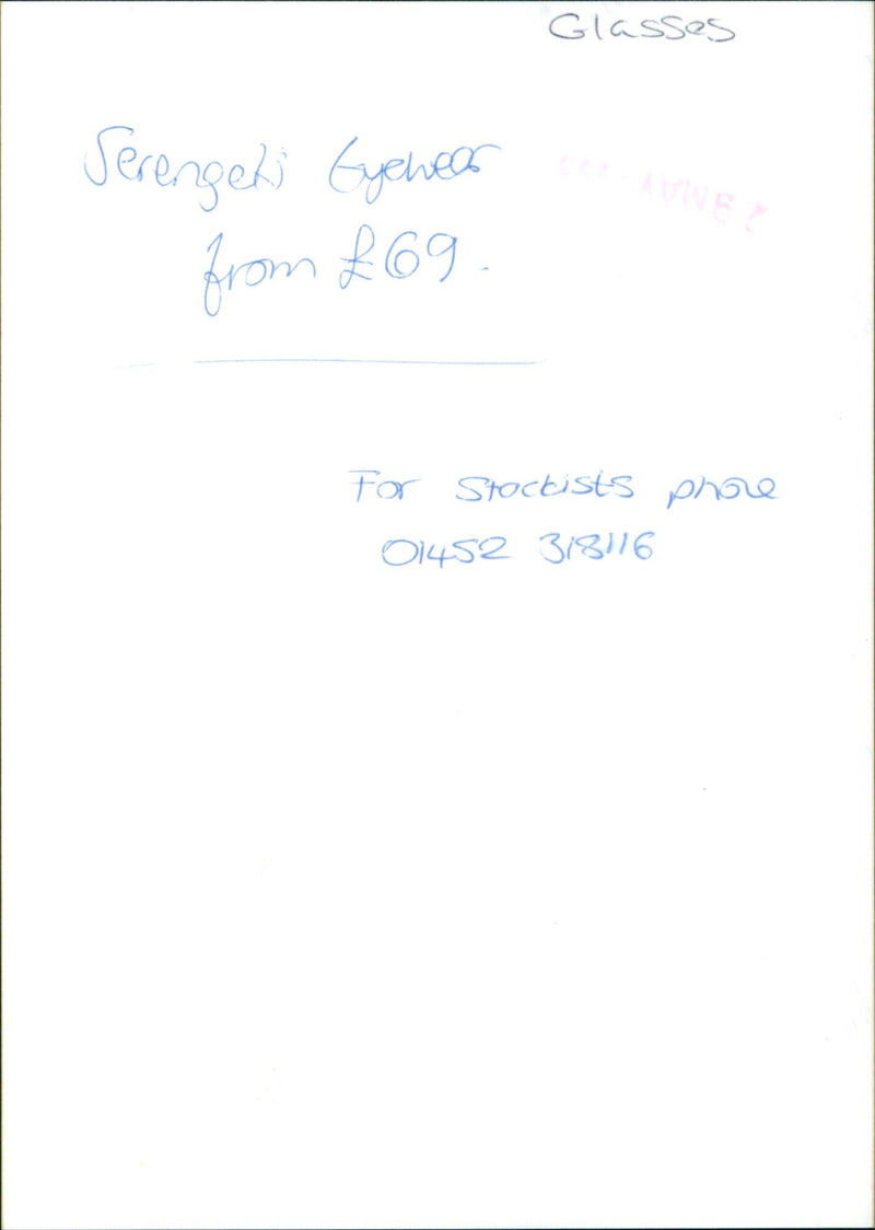 A model wearing a pair of Serengeti Eyewear glasses. - Vintage Photograph