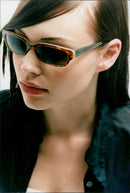 A model wearing a 'Kangol Combination Nerd' eyewear hat. - Vintage Photograph