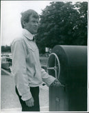 Kenn Goning Lock Watt, the acting lock keeper, stands in front of the lock. - Vintage Photograph