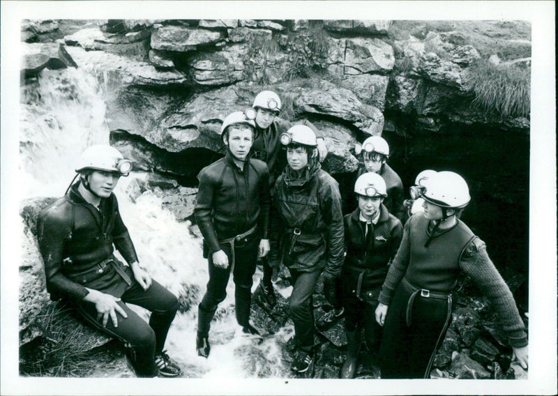 A group of people enjoying an outdoor pot-holing expedition in the Whernside Cave and Fell Centre. - Vintage Photograph