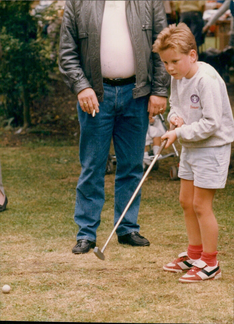 A beaver is seen swimming in a lake in the countryside. - Vintage Photograph