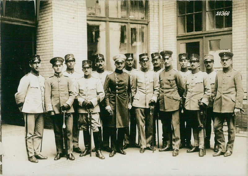 On October 10th, 1936, a study tour group of Swedish officers pose in front of the German border at the E110 MAPPIS checkpoint. - Vintage Photograph