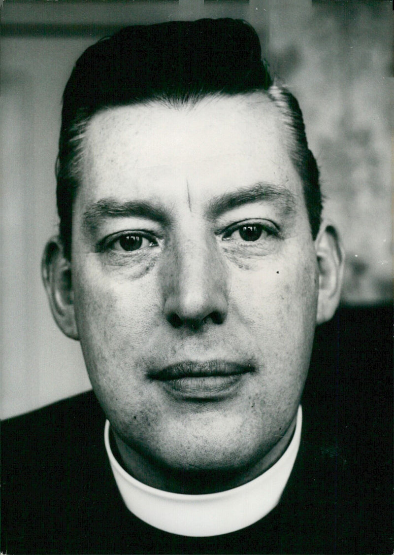 Rev. Ian Paisley, Moderator of the Free Presbyterian Church of Northern Ireland, speaks out against religious mergers and leads protest parades and demonstrations. - Vintage Photograph