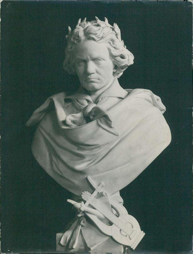 Musician Ludwig van Beethoven holding a violin in a studio, 1927. - Vintage Photograph