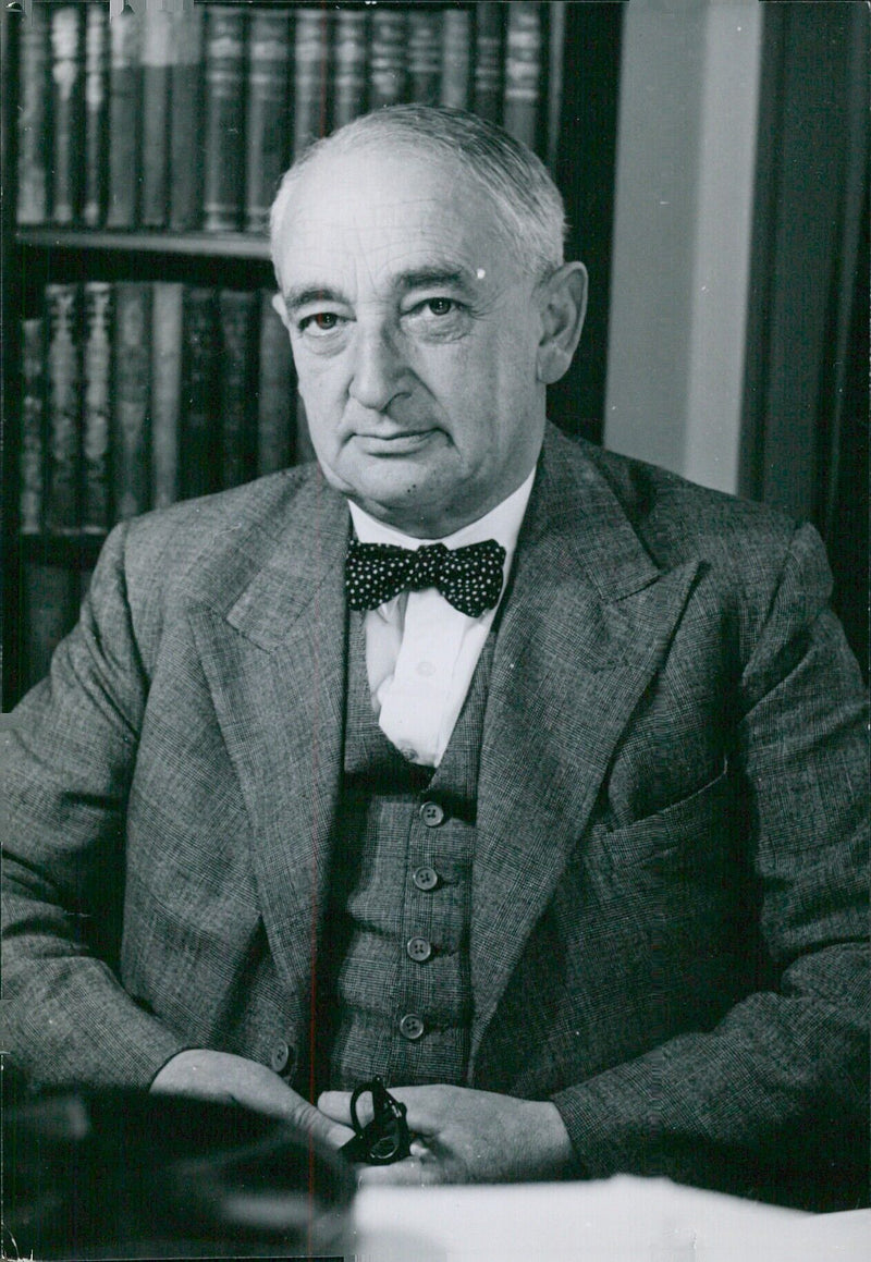 Vice Chancellor of the University of Cambridge, Sydney Castle Roberts, M.A., is pictured at Pembroke College, Cambridge. - Vintage Photograph