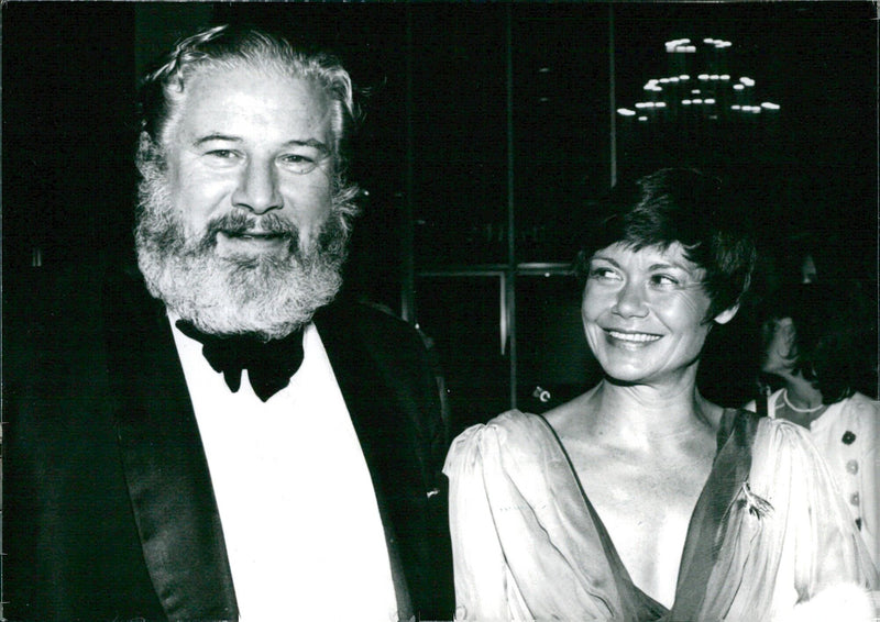 British actor, director, and writer Peter Ustinov and his French wife Hélène Ustinov pose together at a Hollywood function in 1972. - Vintage Photograph