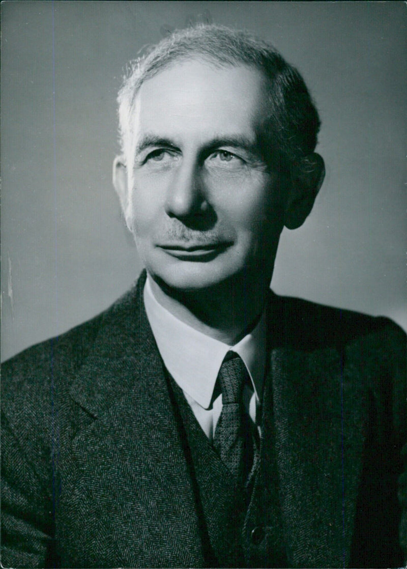 Sir John Porsdyke, K.C.B., Director and Principal Librarian of the British Museum, is pictured in a study by Bassano. - Vintage Photograph