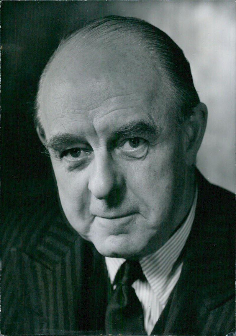 British physician Sir Kenneth Robson, who has been practicing medicine since 1938, is photographed at St. George's Hospital in London, England. - Vintage Photograph