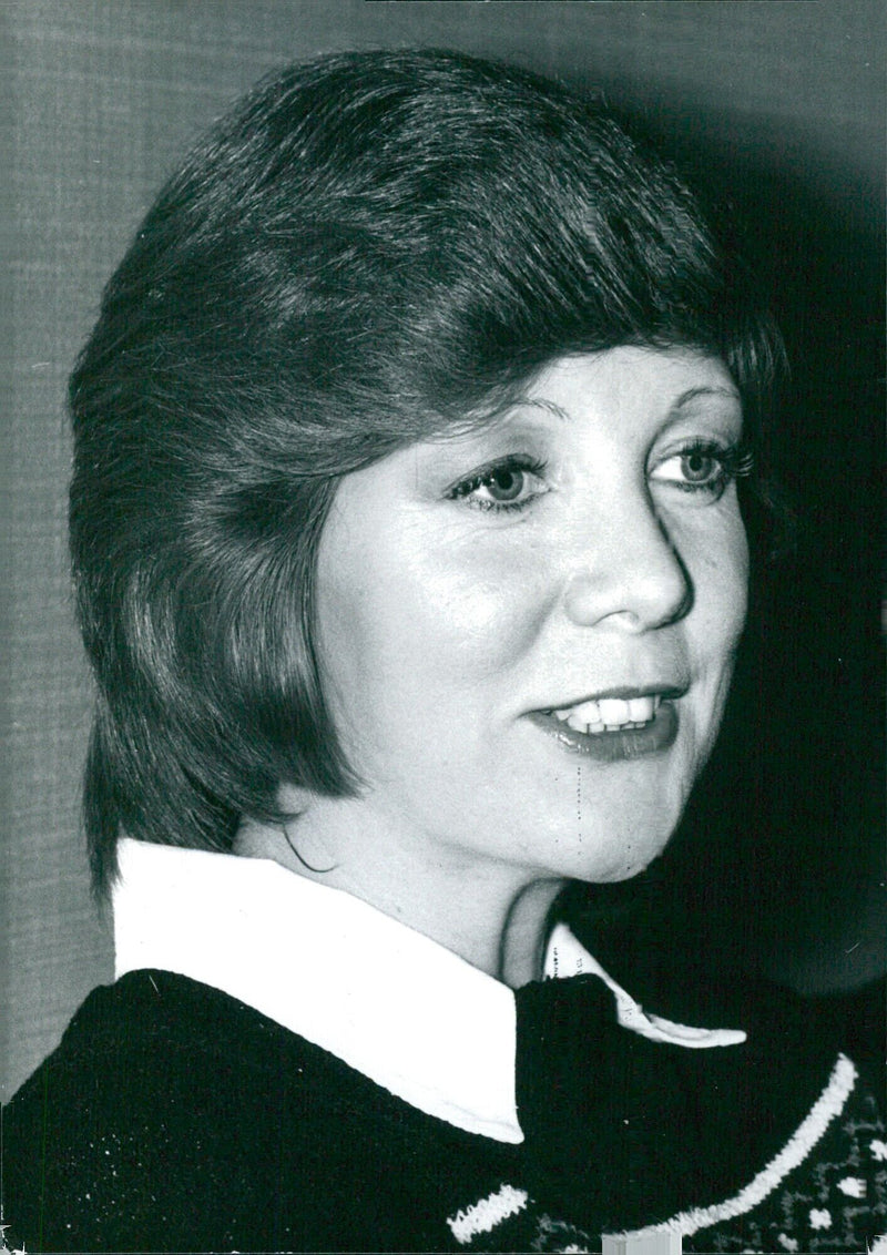 Cilla Black, one of Britain's most successful girl singers, is seen performing at the legendary Cavern club in Liverpool in 1974. - Vintage Photograph