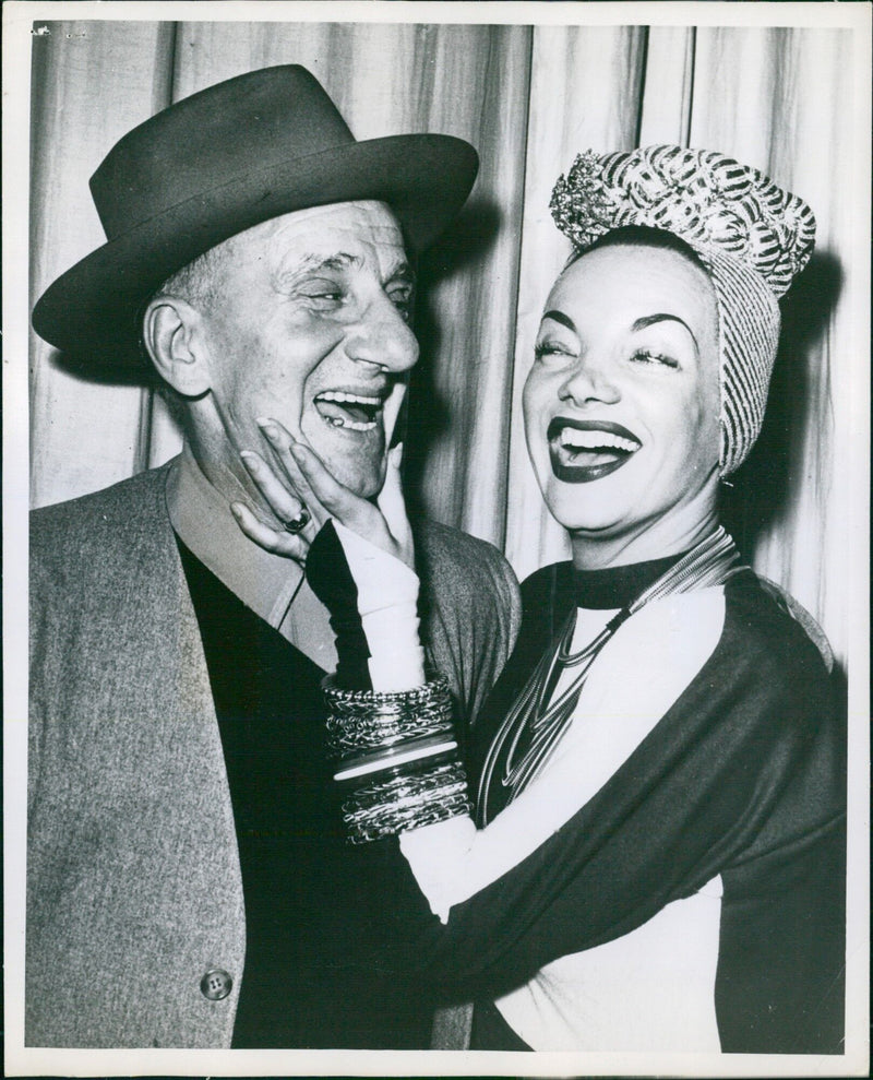 Brazilian actress Carmen Miranda greets comedian Jimmy Durante affectionately in Copenhagen. - Vintage Photograph