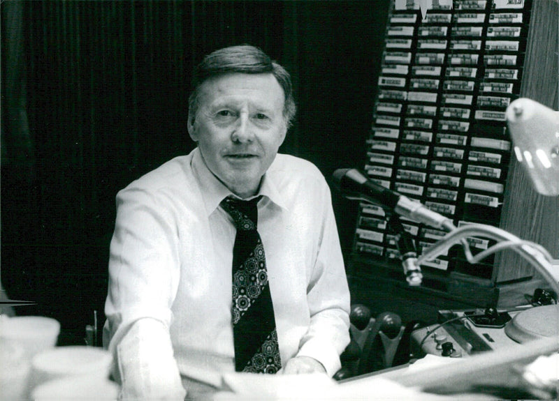 Jimmy Young, a beloved British radio presenter and former singer, is captured here in 1987. - Vintage Photograph