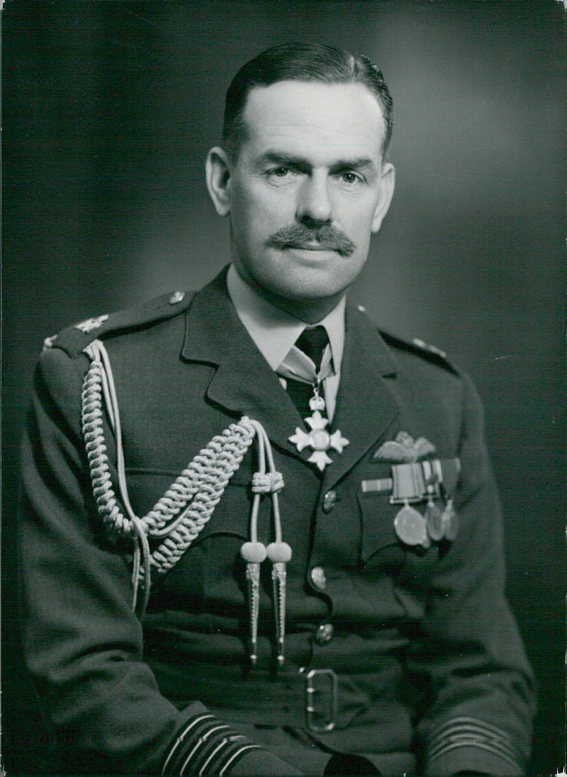 Group Captain B. Robinson, CBE, appointed Aide-de-Camp to H.M. Queen Elizabeth II, is pictured in this portrait taken by Bassano of Camera Press London. - Vintage Photograph