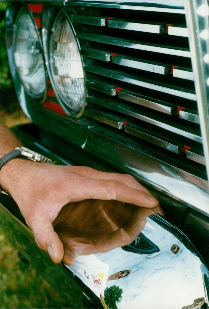 Kim Mulford of Low Buck Cruisers admires a 1959 Edsel Ranger King at the Lazy Day and Car Show. - Vintage Photograph