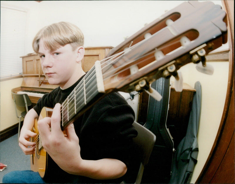 Musicians showcase their talent in competition. - Vintage Photograph