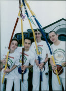 Martial arts and musical instruments are on display at the Cowley Martial Arts and Singing and Musical Instruments studio. - Vintage Photograph