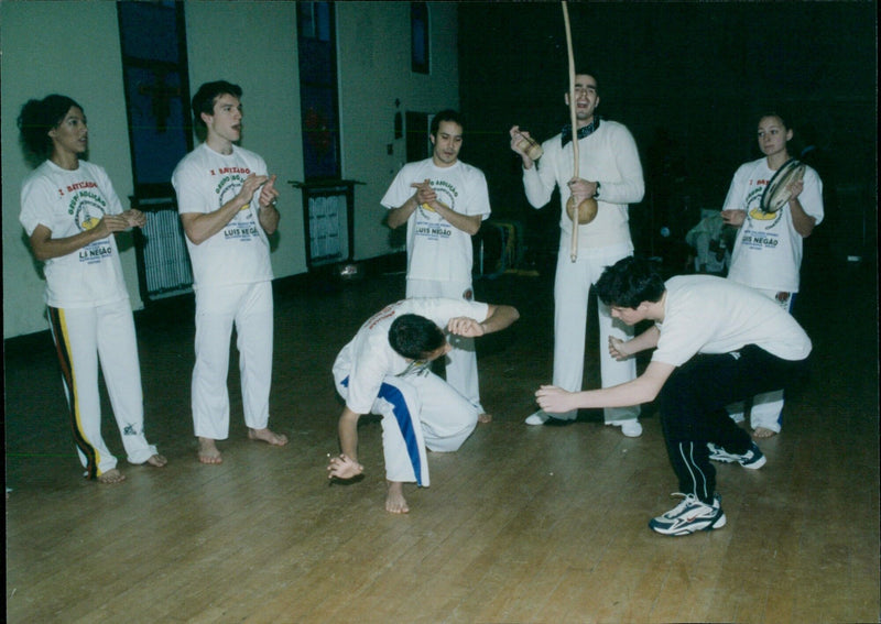 Martial arts and music students demonstrate their skills at Cowley Martial Arts and Singing & Musical Instruments. - Vintage Photograph