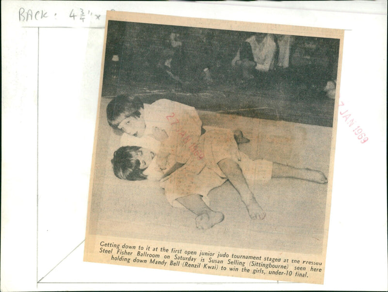 Susan Selling holds down Mandy Bell to win the girls under-10 judo final. - Vintage Photograph