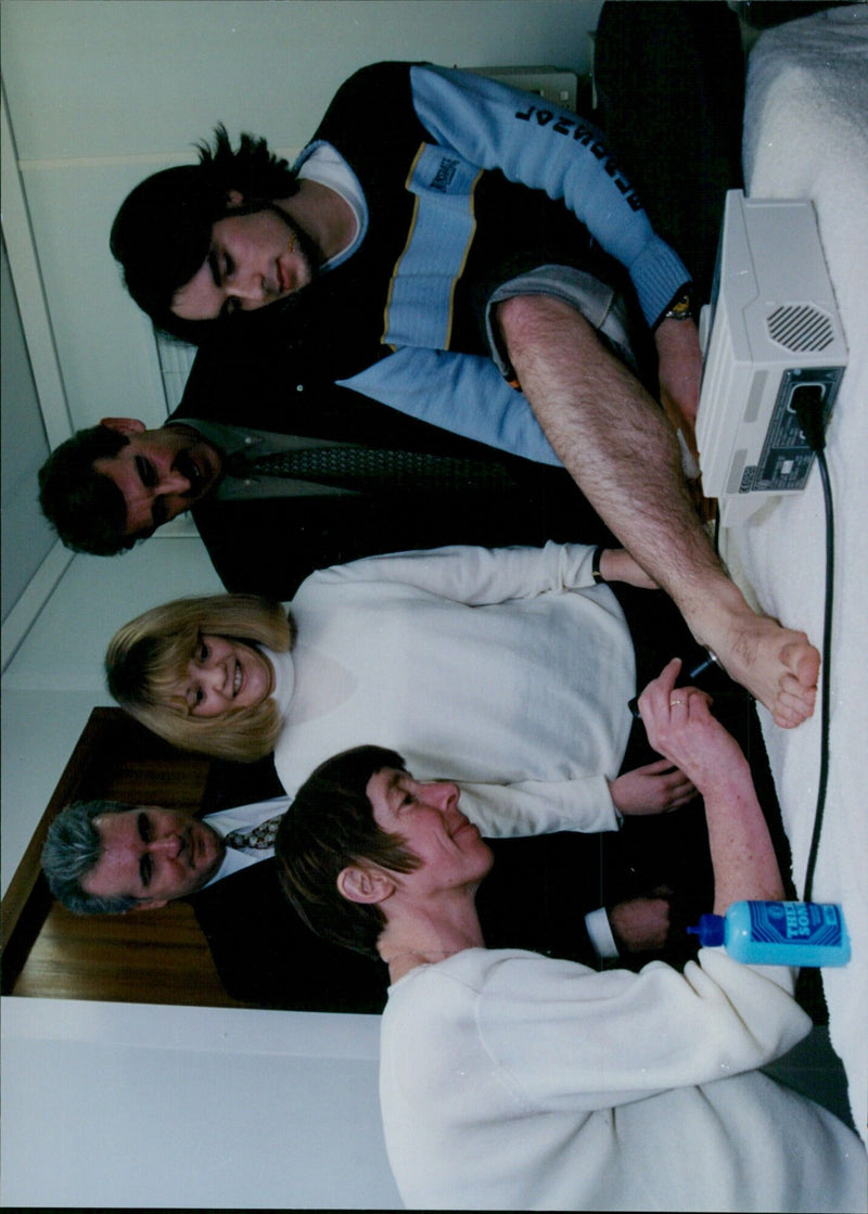 Physiotherapist Femke Maselkowski demonstrates aromatherapy equipment to patients at the Milton Multiple Sclerosis Centre. - Vintage Photograph