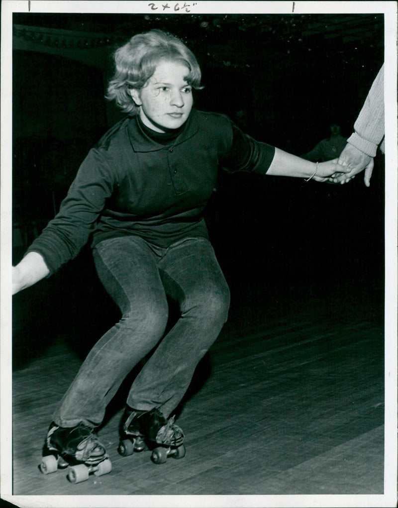 A woman roller skating in Oxford, England. - Vintage Photograph