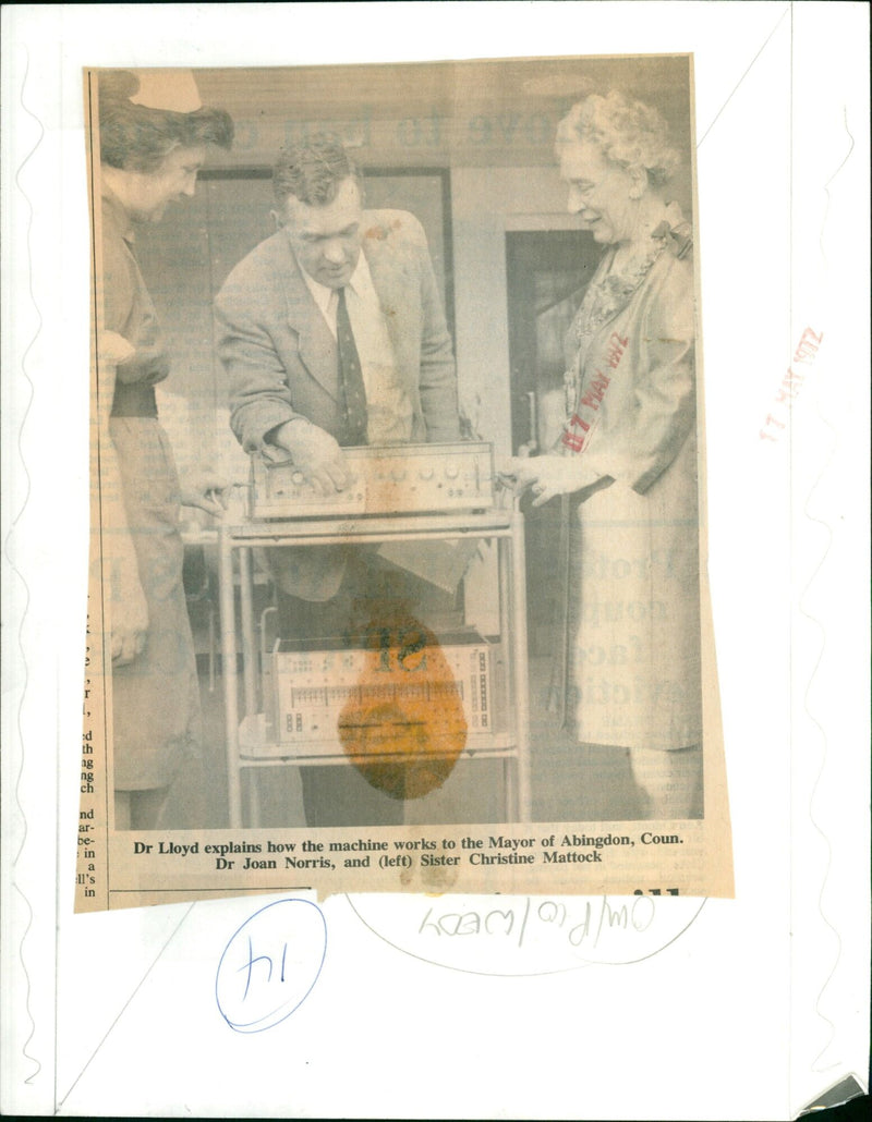 Councillor Dr Joan Norris, Mayor of Abingdon, listens to Dr Lloyd explain the workings of a machine. - Vintage Photograph