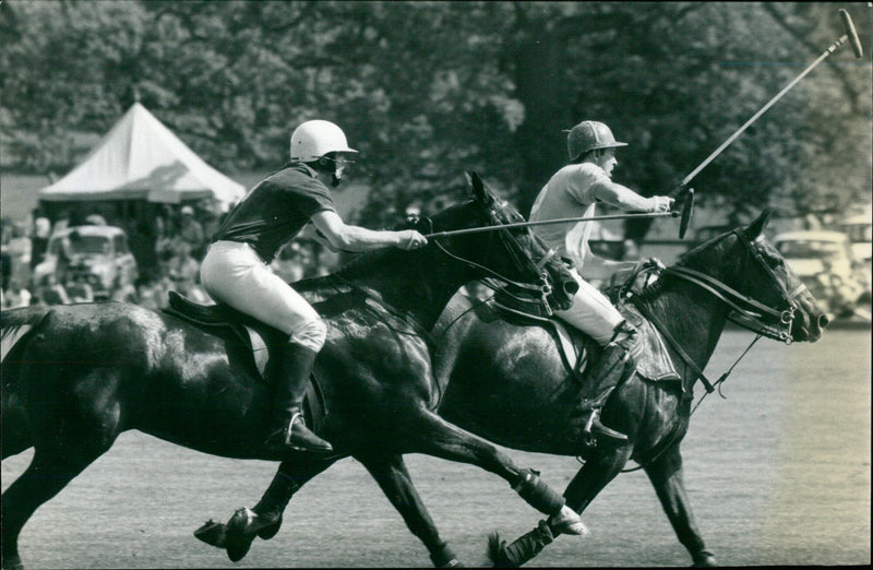 Prince Charles and other players take part in the centenary Varsity polo match at Kirtlington on Saturday. - Vintage Photograph