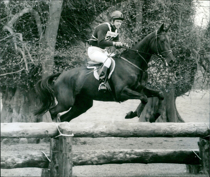 A horse and rider perform a jump at the Pedigree Mu Animals Horse Trials in Charlbury, England. - Vintage Photograph