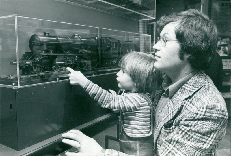 Three-year-old Andrew Francis and his father admire a model locomotive at the Wantage Museum railway exhibition. - Vintage Photograph