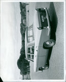 The Wolseley 16/60 Saloon, an upgrade to the popular 15/60 model, features a wider track, longer wheelbase, and a new 1682 c.c. version of the B.M.C. Scrics B engine. - Vintage Photograph