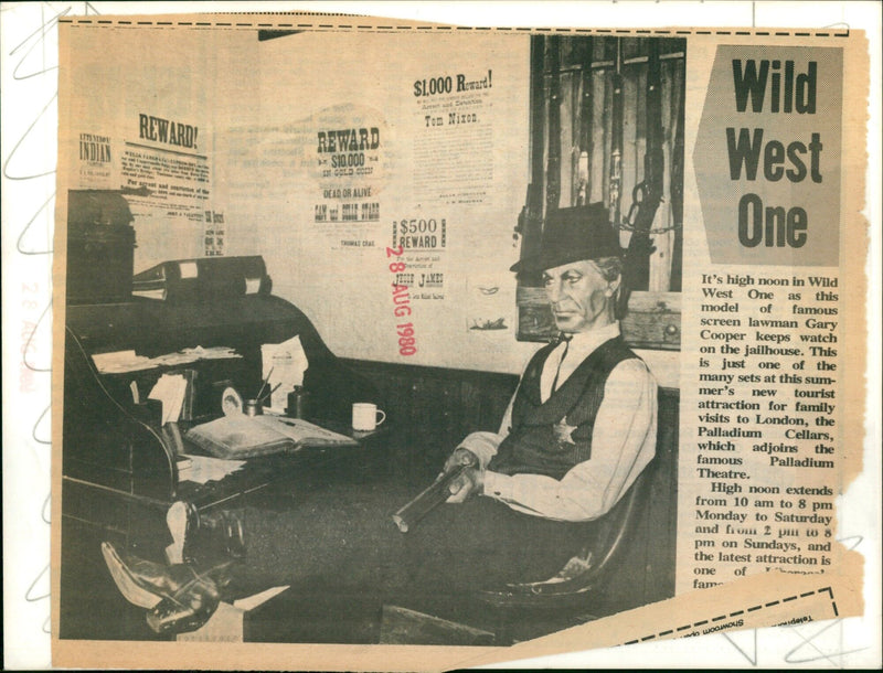 A model of famous screen lawman Gary Cooper keeping watch on a jailhouse set at the Palladium Cellars tourist attraction in London. - Vintage Photograph