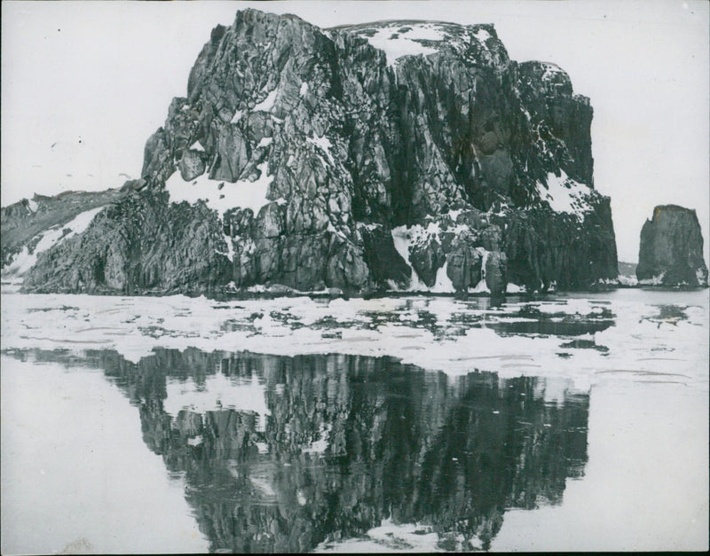 Cliffs of Deception Island, Antarctica, seen in clear weather. - Vintage Photograph