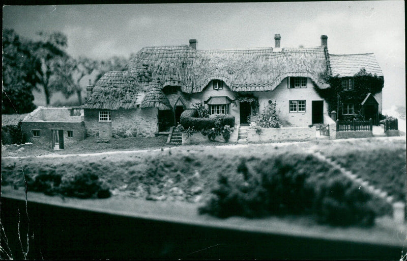 A model of thatched cottages on display at Pendon Museum in Long Wittenham. - Vintage Photograph