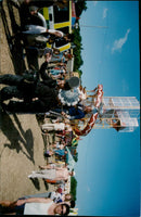 Fans enjoy the sights and sounds of a music festival at Reading. - Vintage Photograph