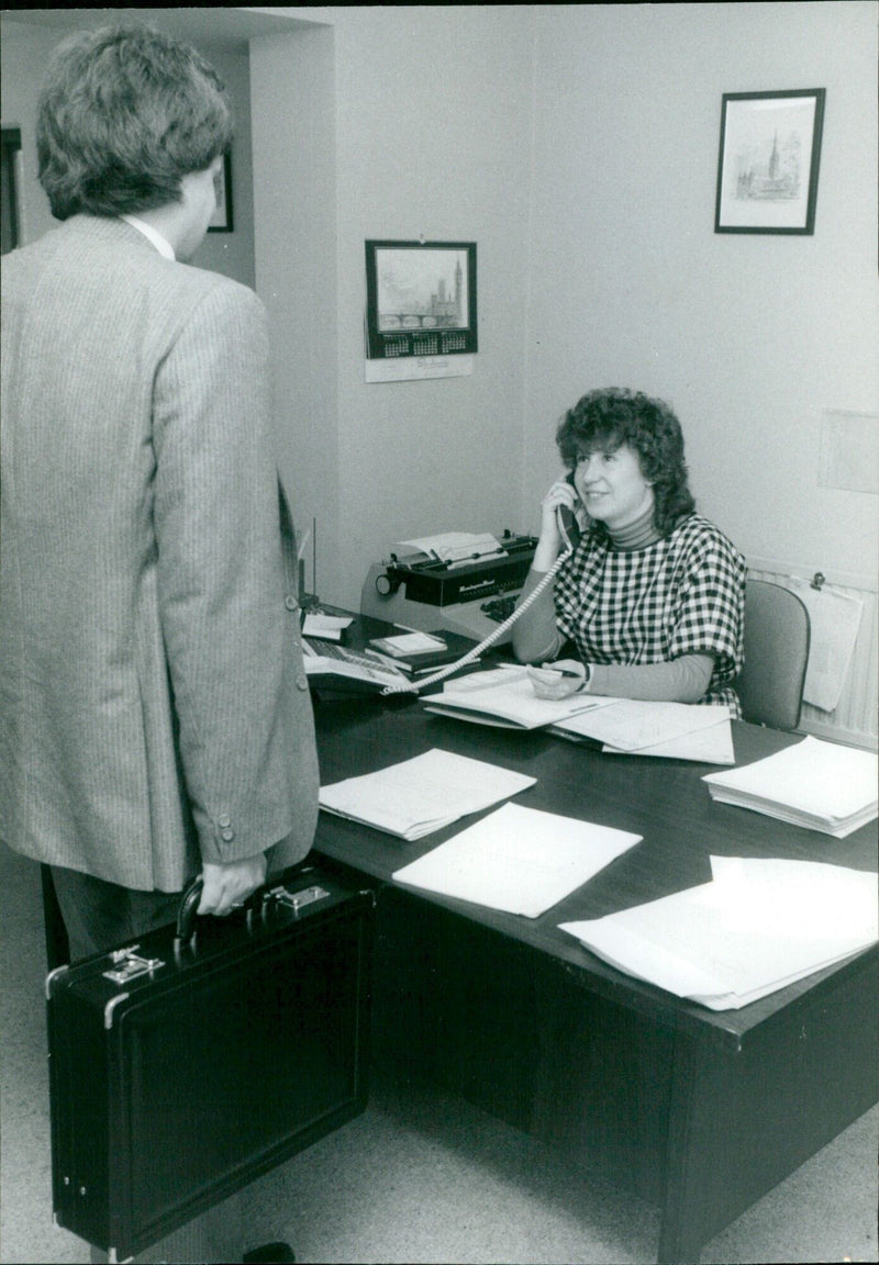 A young girl examines a caterpillar in a park. - Vintage Photograph