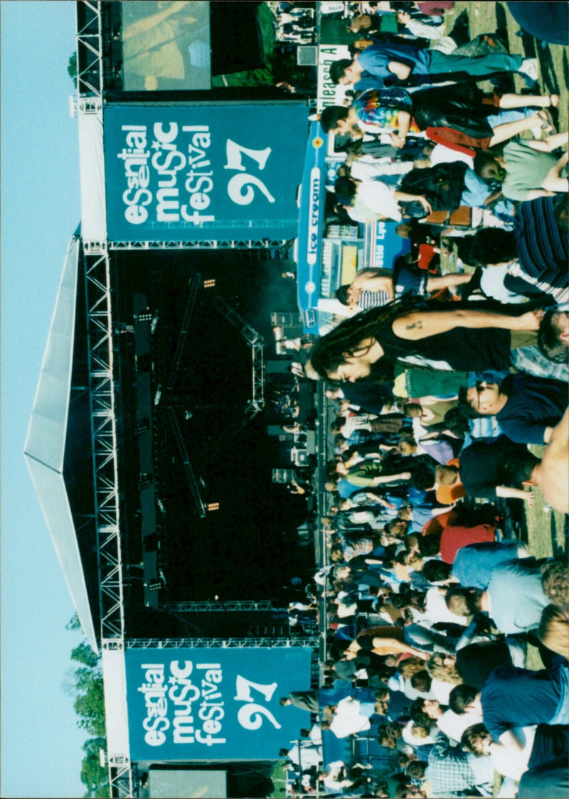 People enjoying ice cream treats at the Esantal Music Festival. - Vintage Photograph