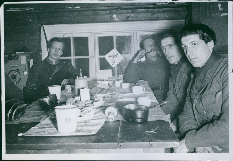 Soldiers having a meal together during WWII in Sweden. - Vintage Photograph